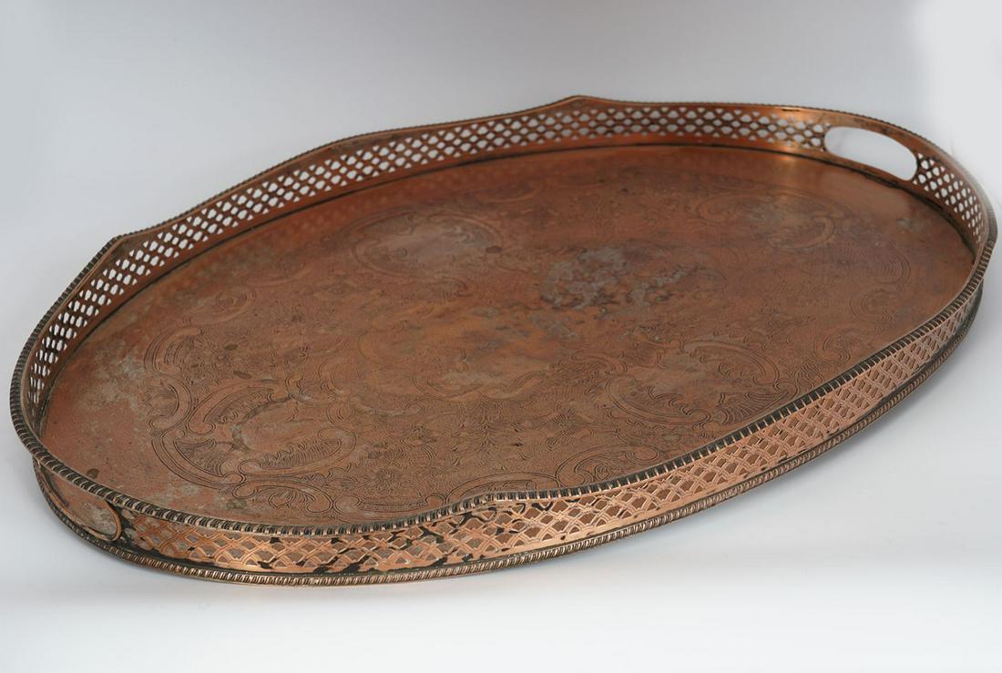 GEORGE III SHEFFIELD GALLERY TRAY: silver plated, of oval shape, the platform with engraved armorial cartouches 60 x 40 cm.