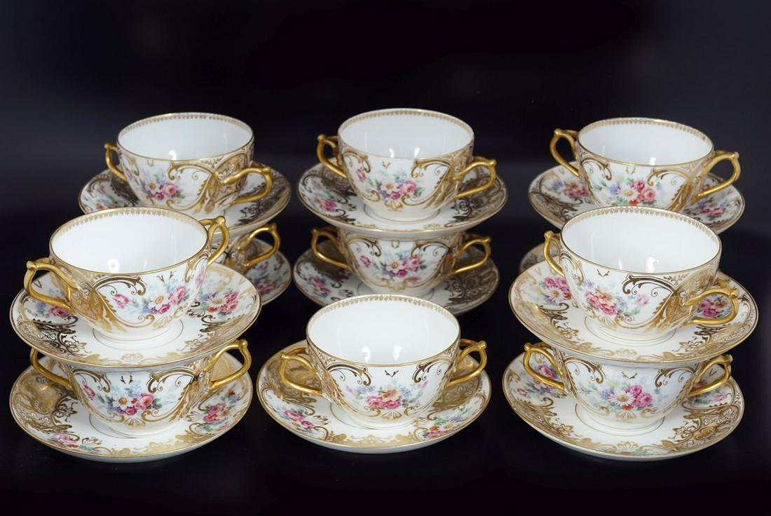 LIMOGES SOUP SERVICE: Bernardaud and Co. Comprising: 10 cups and 10 saucers, each with parcel gilt and painted floral decoration. Retail inscription Higgins and Seiter, New York