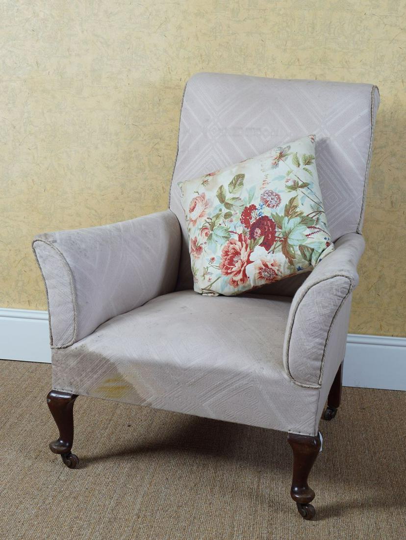 EDWARDIAN UPHOLSTERED ARMCHAIR: raised on cabriole legs to the fore 98 cm. high; 70 cm. wide; 70 cm. deep