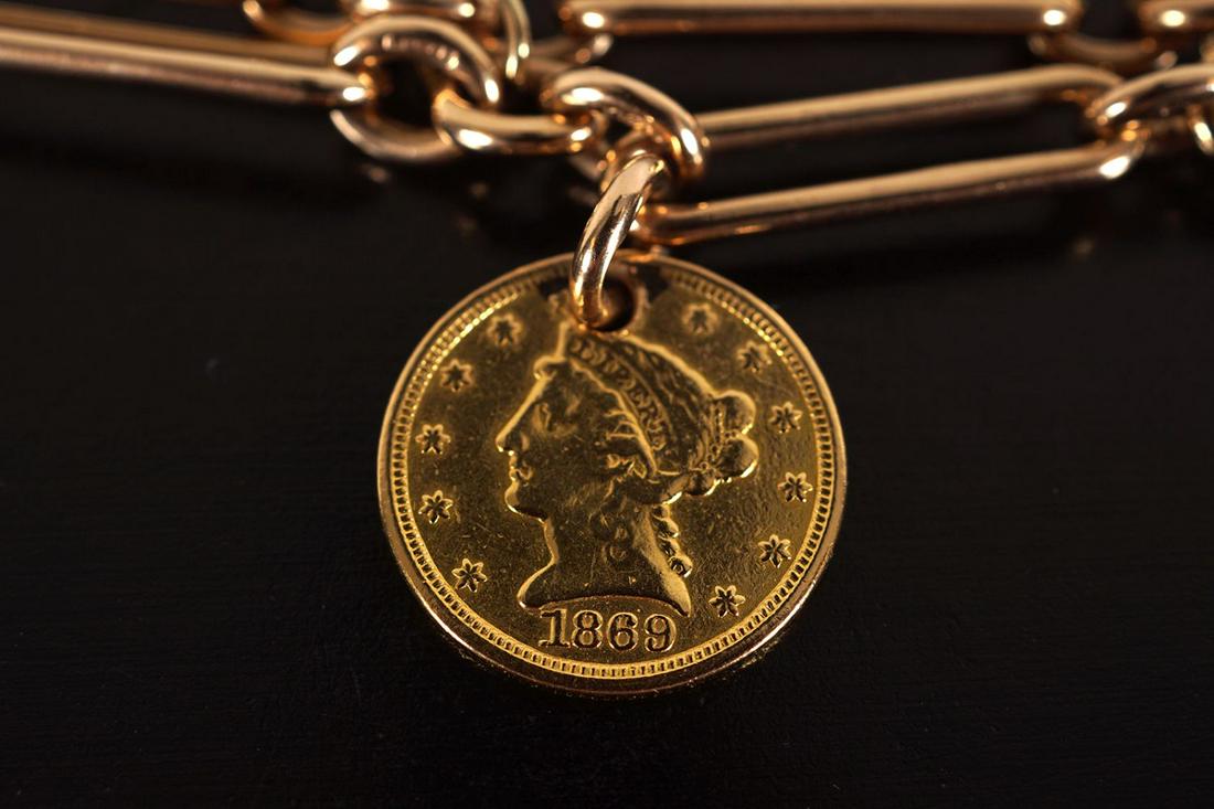 9 CT GOLD LINK BRACELET: with American $2.5 dollar gold coin, 1869. Total weight of bracelet and coin: 34g