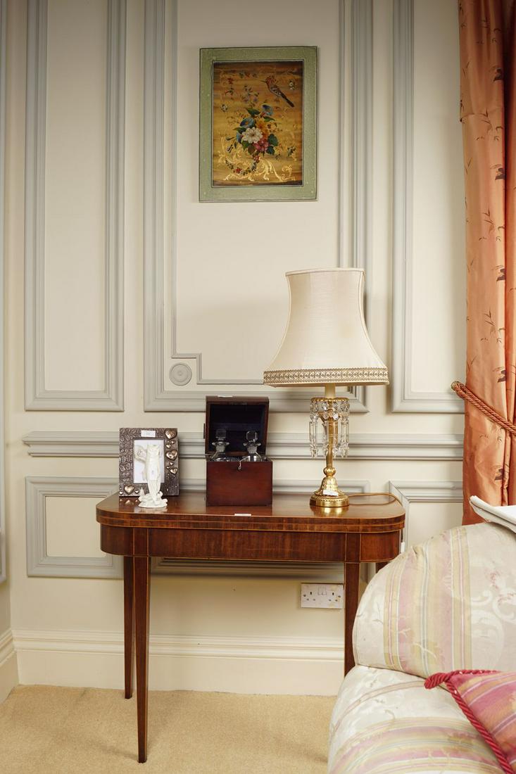 GEORGE III PERIOD MAHOGANY TEA TABLE: the boxwood inlaid rectangular shaped top with rounded corners to the fore, opening to a polished interior, above a conforming frieze, raised on square tapered legs 73 cm. high; 92 cm. wide; 45 cm. de
