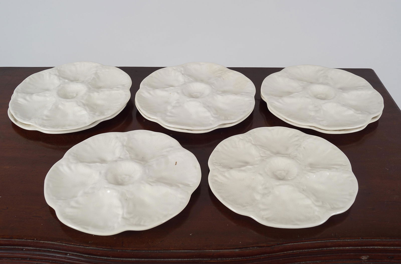 SET OF EIGHT GIEN OYSTER PLATES: each of six compartments 24 cm. diameter