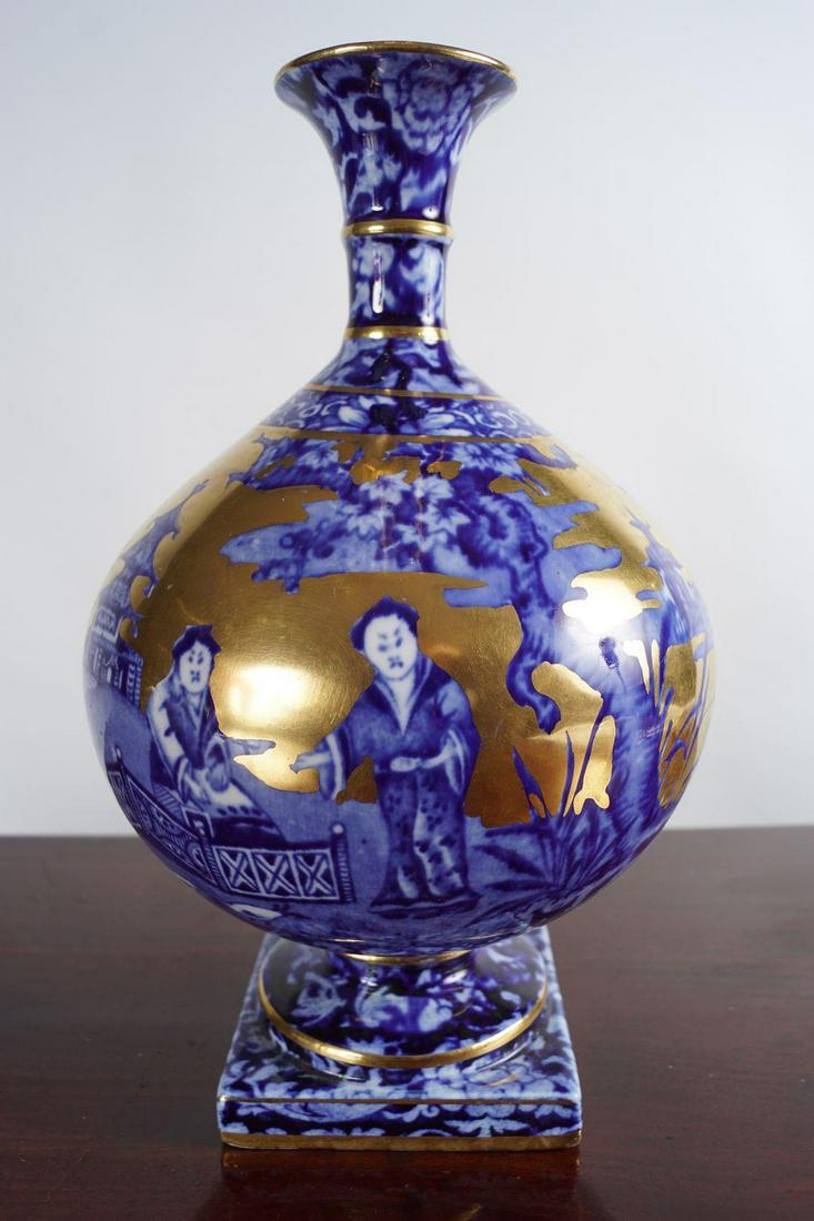 19TH-CENTURY BLUE AND WHITE VASE: of bottle shape with parcel gilt decoration. J. Kent Foley ware Fenton, England. 21 cm. high