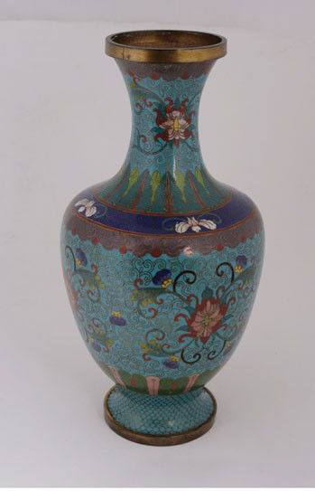 Chinese cloisonne vase: Chinese cloisonne vase,of baluster form with a trumpet neck, floral decoration amongst a maze of scrolls 34 cms. high