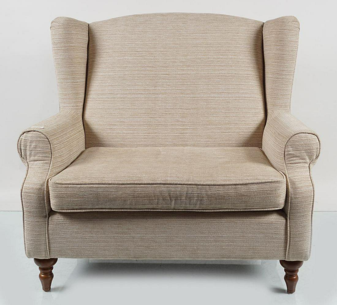 PAIR OF MODERN 2-SEATER SETTEES: each with a loose cushioned seat, raised on turned legs to the fore. 110 cm. high; 115 cm. wide; 80 cm. deep