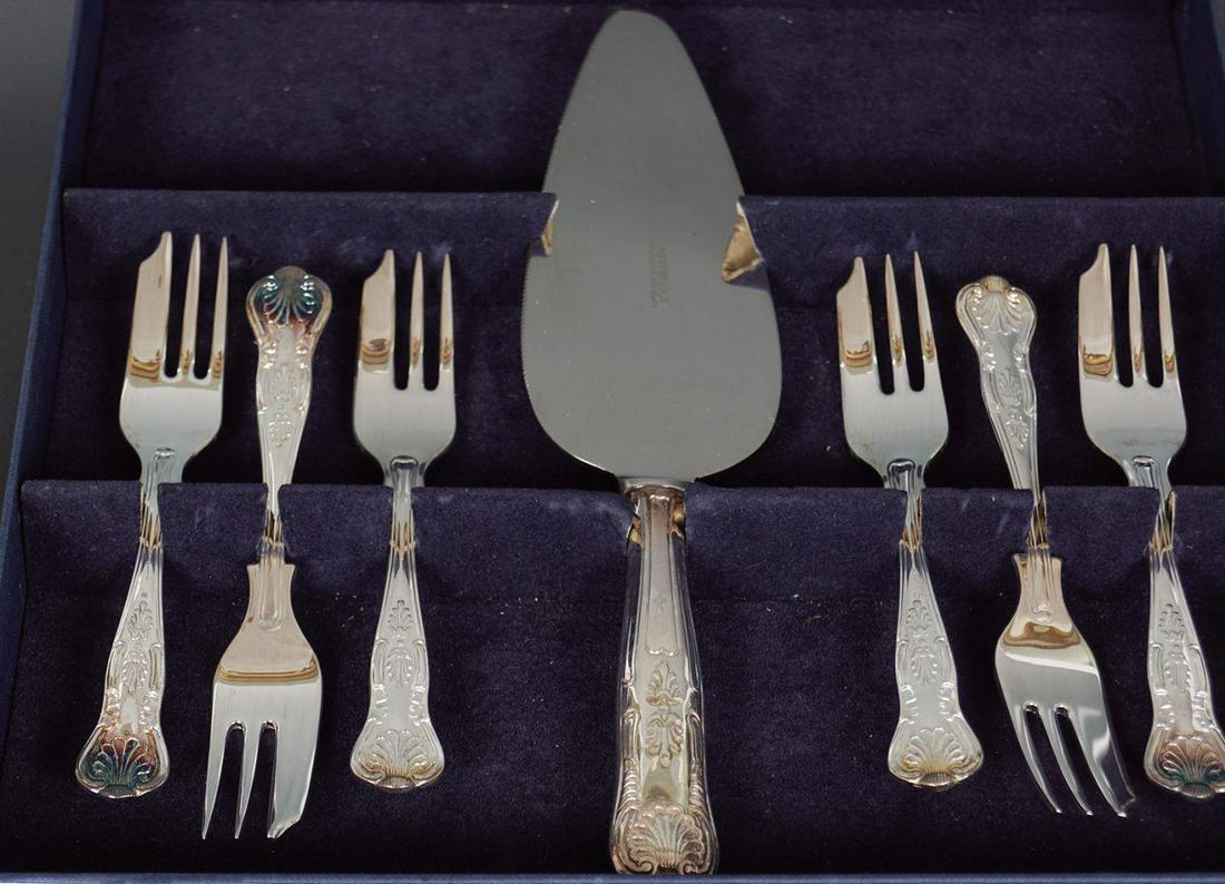 SIX NEWBRIDGE CAKE FORKS: and a cake knife. Cased.