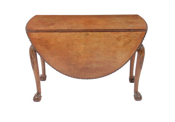 Antique Irish mahogany gate legged table: Antique Irish mahogany gate legged table,the rectangular top with rounded ends and D-shaped drop leaves, decorated with a gadrooned border, raised on acanthus leaf headed cabriole legs, terminating on