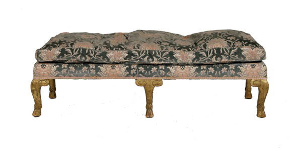 Nineteenth-century upholstered and gilt fender st: Nineteenth-century upholstered and gilt fender stool,the elongated rectangular seat raised on cabriole legs, terminating on hoofed feet