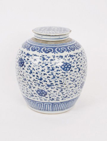Large eighteenth-century Chinese blue and white g: Large eighteenth-century Chinese blue and white ginger jar and lid,of bulbous form with overall prunus decoration 25 cm. high