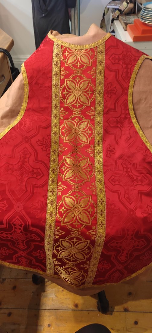 19TH-CENTURY RED DAMASK VESTMENT SET: with gold trim. Comprising: burse, maniple, chalice veil, chasuble and stole.