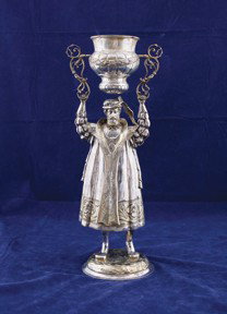 Late nineteenth-century German sterling silver wager cu: Late nineteenth-century German sterling silver wager cup,raised on a cloaked figure,1154 grams,Provenance: The Kennedy Collection, Connecticut