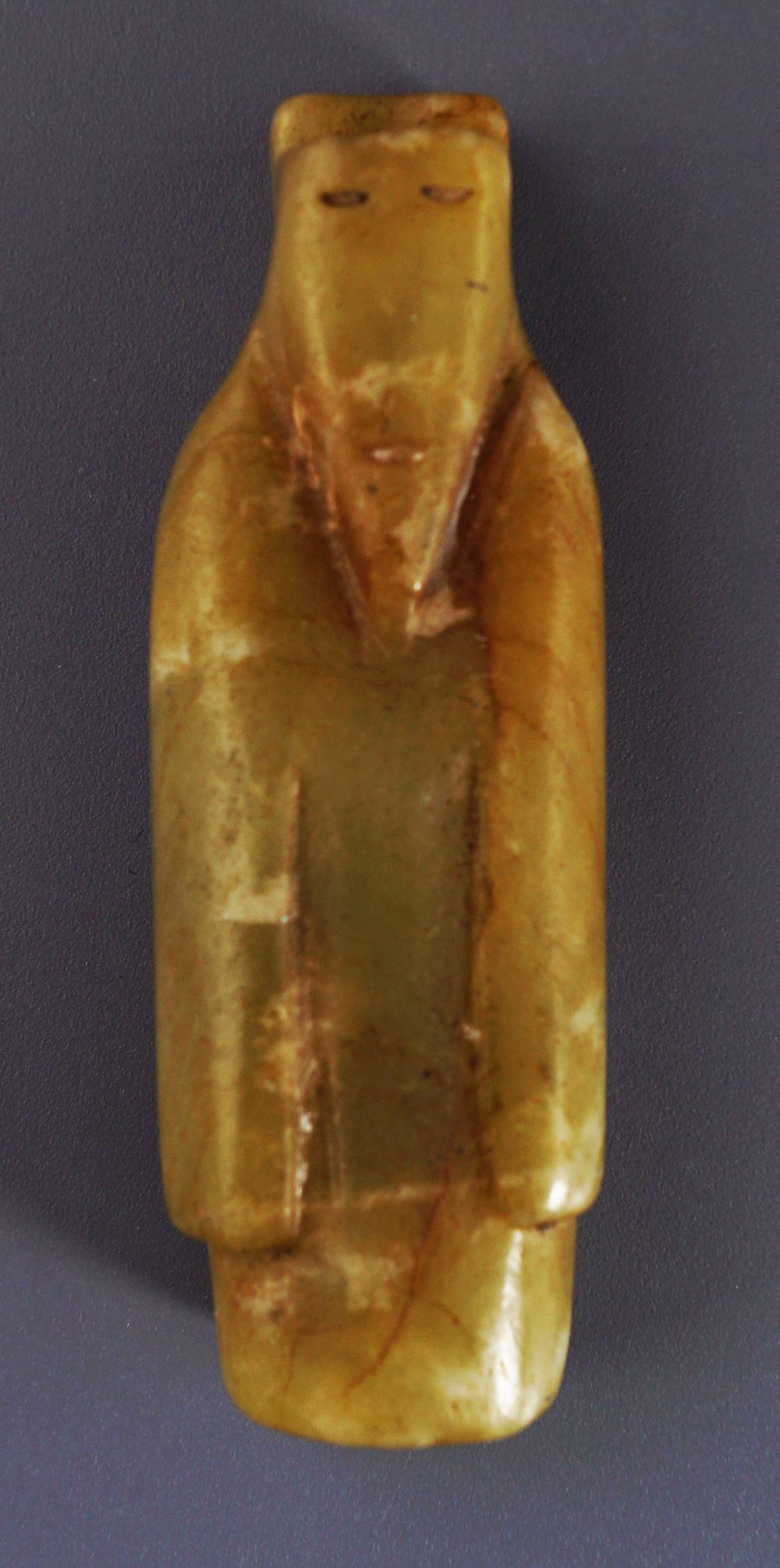 CHINESE ARCHAIC CELADON JADE CICADA PENDANT: Chinese archaic celadon jade cicada pendant.Provenance: The Collection of the late Dr. Jan Mohamed, Pouldrew House, Co. Waterford. 6.5 cm. long(Lot 1513)