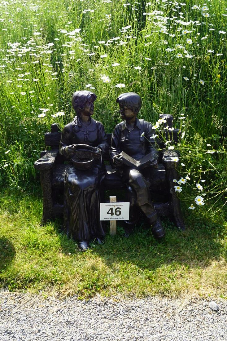 BRONZE GARDEN SCULPTURE GROUP: Figures seated on a garden bench. 110 cm. high; 125 cm. wide; Approximate Time: 10:40 Lot No: 46 Category: Garden & Decorative Objects