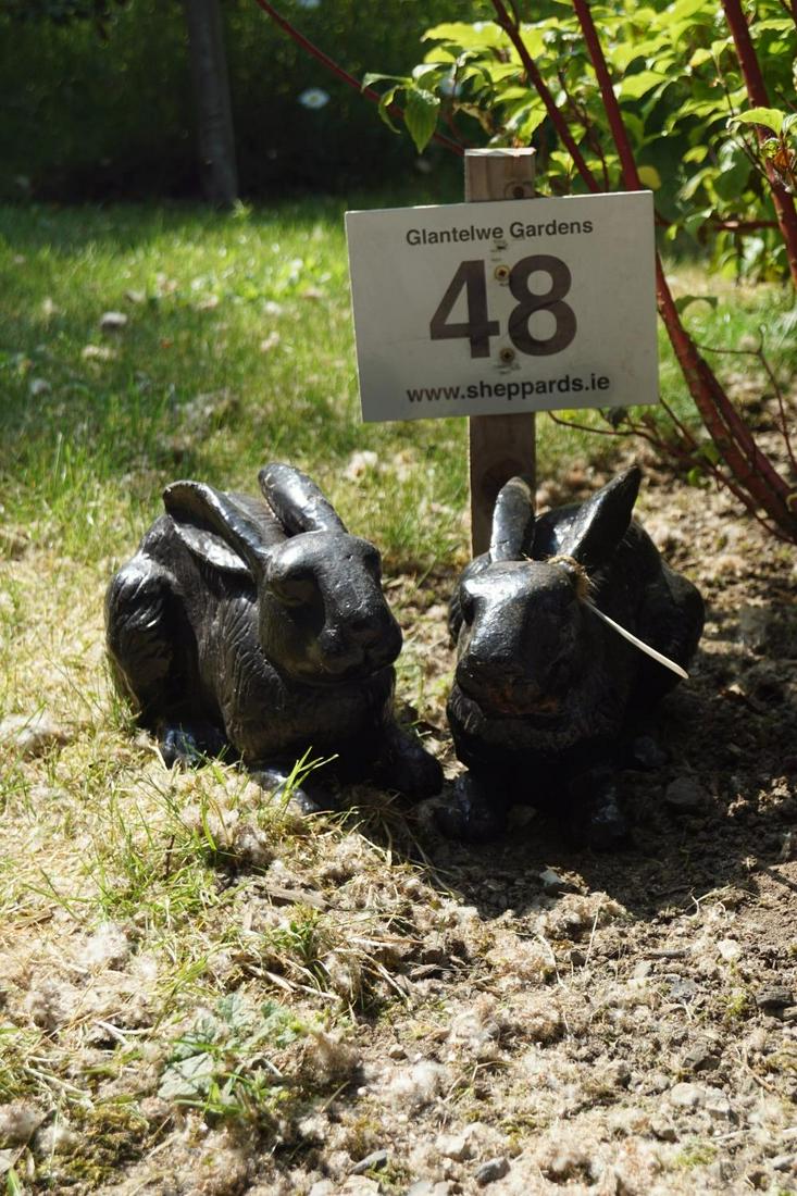 PAIR OF CAST IRON RABBITS: each resting. 36 cm. high; 28 cm. wide Approximate Time: 10:42 Lot No: 48 Category: Garden & Decorative Objects