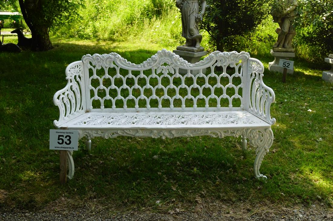CAST IRON CARRON GARDEN BENCH: with horseshoe panelled back and C-scroll panelled seat, raised on scroll ends. 96 cm. high; 260 cm. wide Approximate Time: 10:46 Lot No: 53 Category: Garden & Decorative Objects