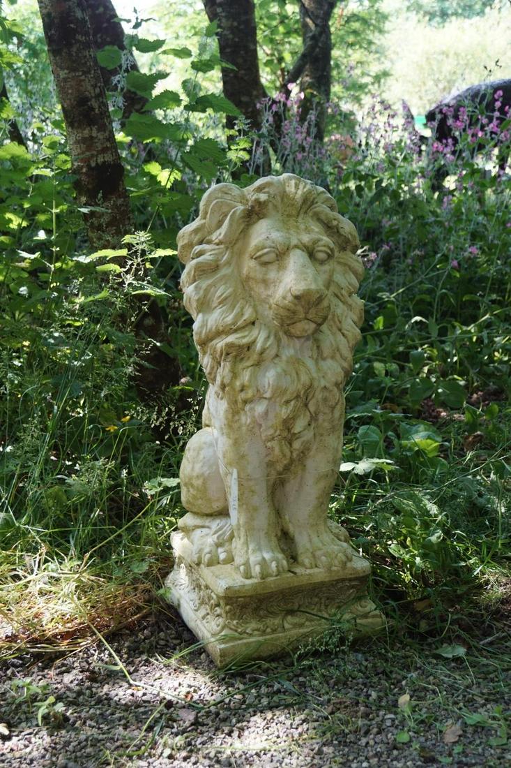 PAIR OF MOULDED STONE LIONS: each resting on its hind quarters, raised on a square plinth. 80 cm. high; 35 cm. wide; 35 cm. deep; Approximate Time: 10:54 Lot No: 62 Category: Garden & Decorative Objects