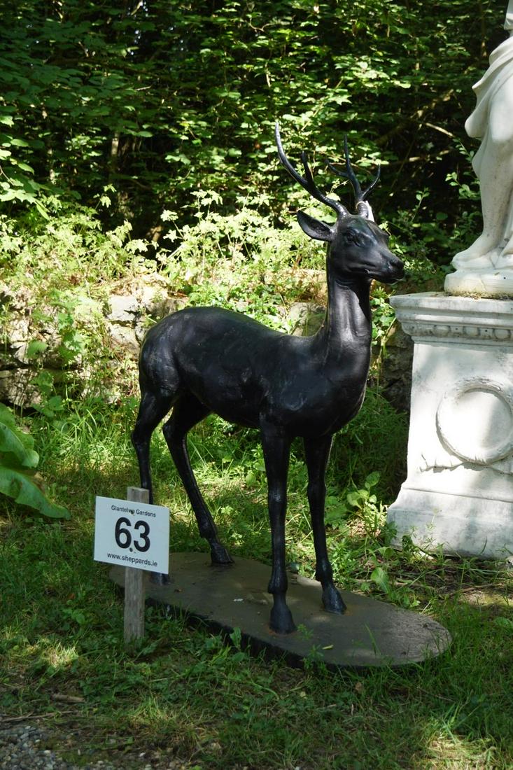 CAST IRON GARDEN SCULPTURE: Figure of a young deer mounted on an oval plinth. 122 cm. high; 102 cm. wide; 43 cm. deep Approximate Time: 10:55 Lot No: 63 Category: Garden & Decorative Objects