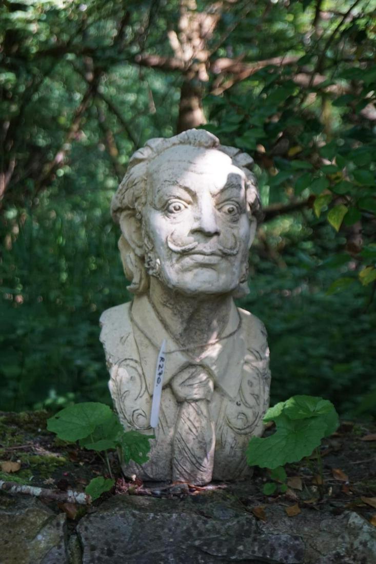 STONE GARDEN SCULPTURE: Figure of Salvador Dali. 50 cm. high; 26 cm. wide Approximate Time: 11:03 Lot No: 71 Category: Garden & Decorative Objects