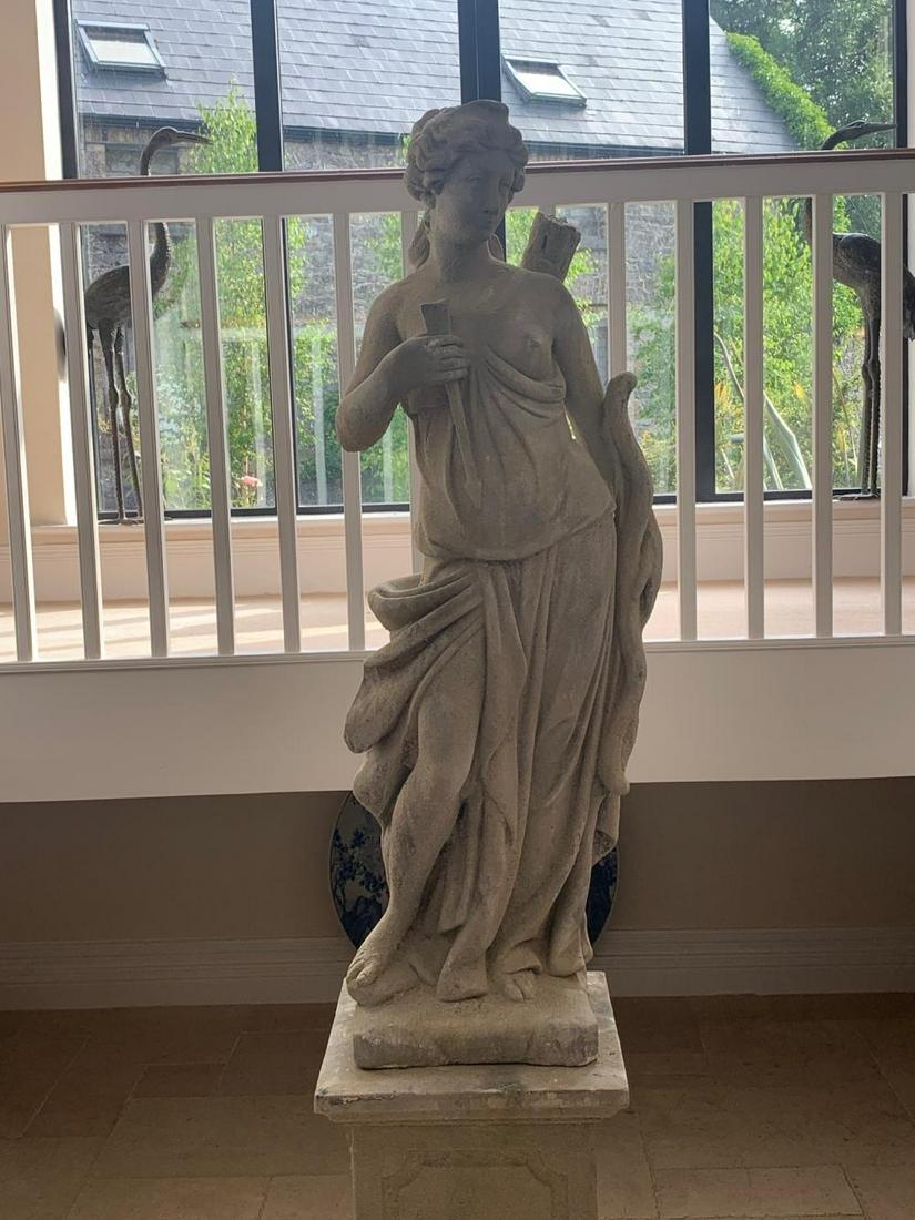 ITALIANATE STONE FIGURE: of Diana, raised on a square plinth. 200 cm. high Approximate Time: 11:05 Lot No: 74 Category: Garden & Decorative Objects