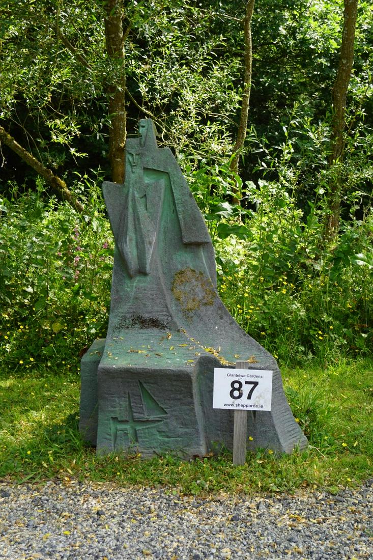 ART DECO LIMESTONE GARDEN SCULPTURE: Abstract figures with long flowing robes. 140 cm. high; 84 cm. wide; 58 cm. deep; Approximate Time: 11:17 Lot No: 87 Category: Garden & Decorative Objects