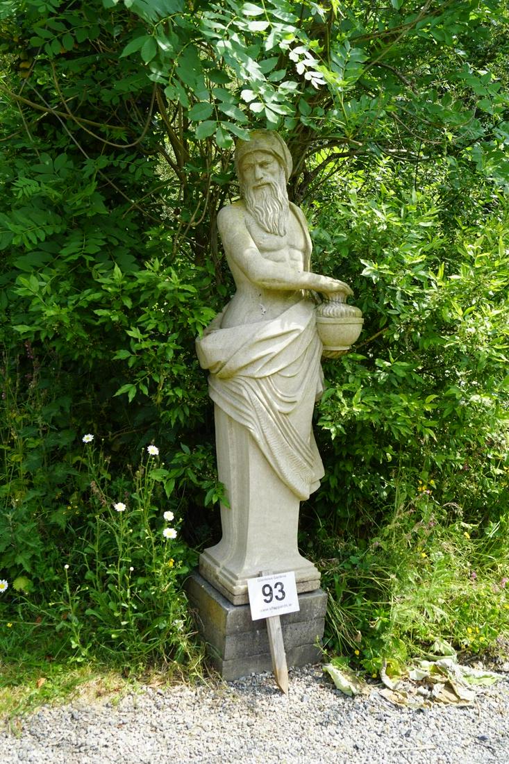 CARVED STONE GARDEN SCULPTURE: Allegorical figure draped in long flowing robes holding a flaming urn. 180 cm. high; Approximate Time: 11:22 Lot No: 93 Category: Garden & Decorative Objects