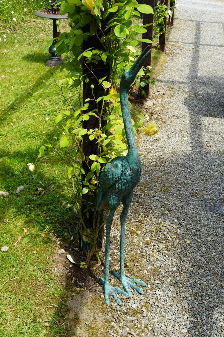 PAIR OF BRONZE GARDEN SCULPTURES: each a stork, one with its head head high, the other bowed. 87 cm. high; Approximate Time: 11:39 Lot No: 111 Category: Garden & Decorative Objects