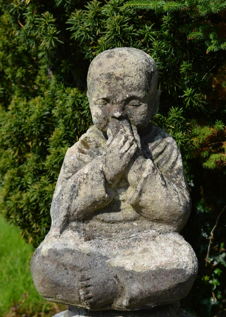 MOULDED STONE SCULPTURE: Young Buddha seated. 50 cm. high; 30 cm. wide; Approximate Time: 11:41 Lot No: 114 Category: Garden & Decorative Objects