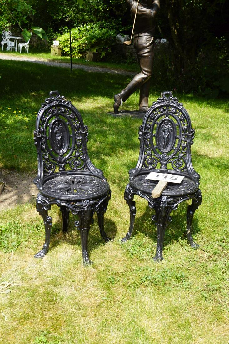 PAIR OF CAST IRON COALBROOKDALE DESIGN CHAIRS: each with a cameo shaped back. 93 cm. high; 46 cm. wide Approximate Time: 11:42 Lot No: 115 Category: Garden & Decorative Objects