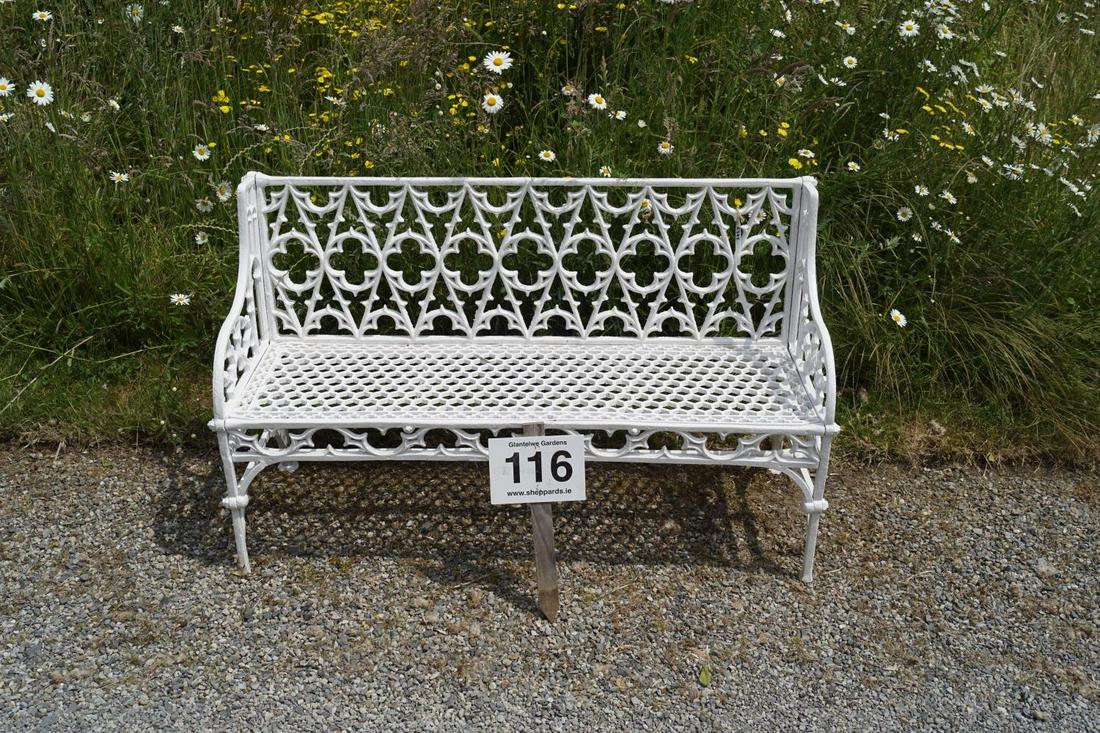 HEAVY CAST IRON VAL D'OSNE GARDEN BENCH: with Gothic tracery panelled back and honeycomb seat, raised on scroll ends. 85 cm. high; 149 cm. wide; 45 cm. deep Approximate Time: 11:43 Lot No: 116 Category: Garden & Decorative Objects