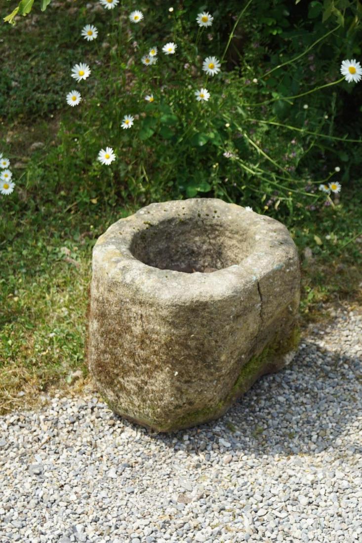 18TH-CENTURY SANDSTONE TROUGH: of circular chamfered form. 40 cm. high; 40 cm. diameter Approximate Time: 11:49 Lot No: 123 Category: Garden & Decorative Objects