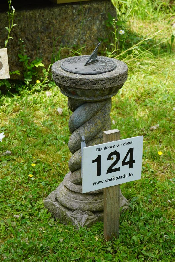 MOULDED STONE STEMMED BRONZE SUNDIAL: the spiral turned stem and square base. 63 cm. high; Approximate Time: 11:50 Lot No: 124 Category: Garden & Decorative Objects
