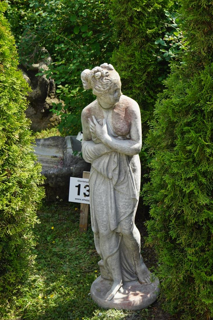 LARGE WEATHERED MOULDED STONE SCULPTURE: Figure of Venus mounted on a circular plinth centred on a circular platform base. 150 cm. high; Approximate Time: 12:04 Lot No: 139 Category: Garden & Decorative Objects