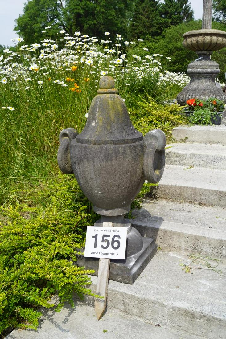 PAIR OF 18TH-CENTURY STONE URNS: each of vase shape furnished with ring handles, raised on a turned stem and square base. 100 cm. high; 56 cm. wide; Approximate Time: 12:19 Lot No: 156 Category: Garden & Decorative Objects