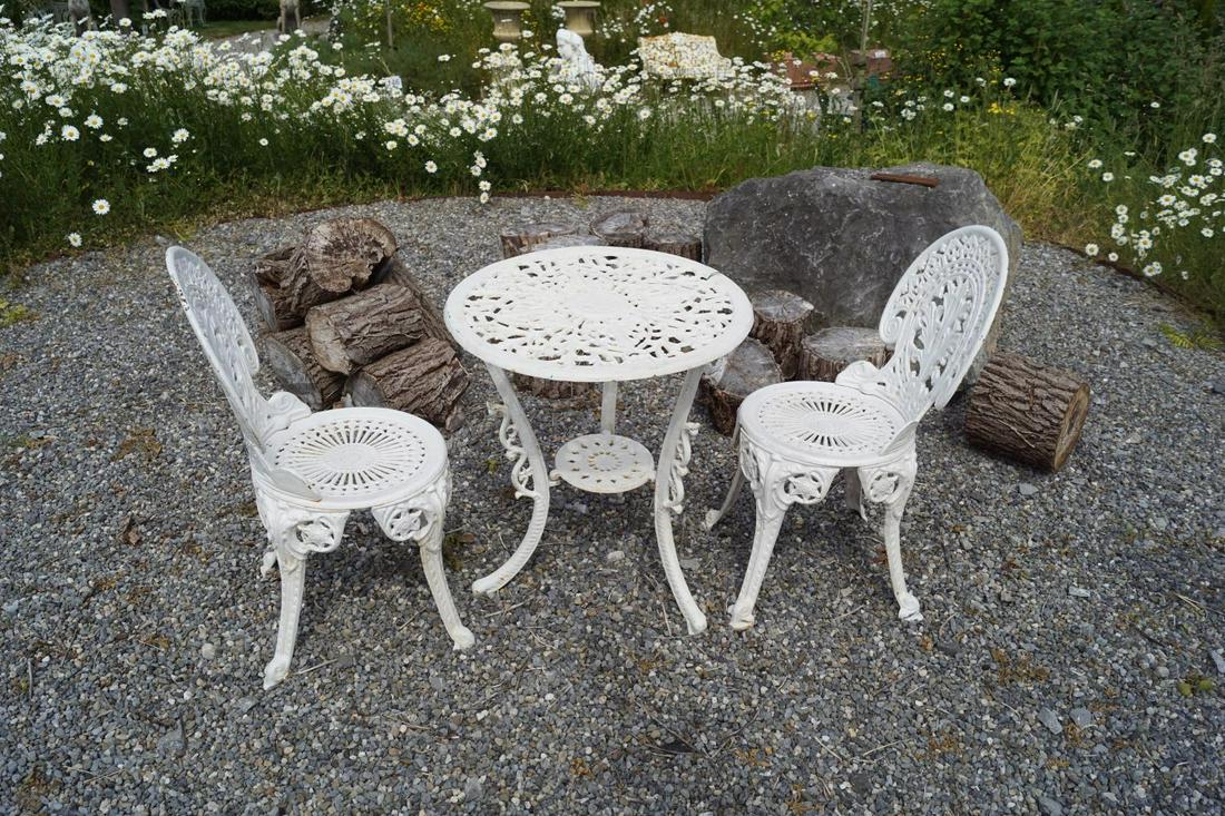 CAST IRON ROCOCO STYLE PATIO TABLE: and two chairs. Table: 60 cm. diameter Approximate Time: 12:23 Lot No: 160 Category: Garden & Decorative Objects