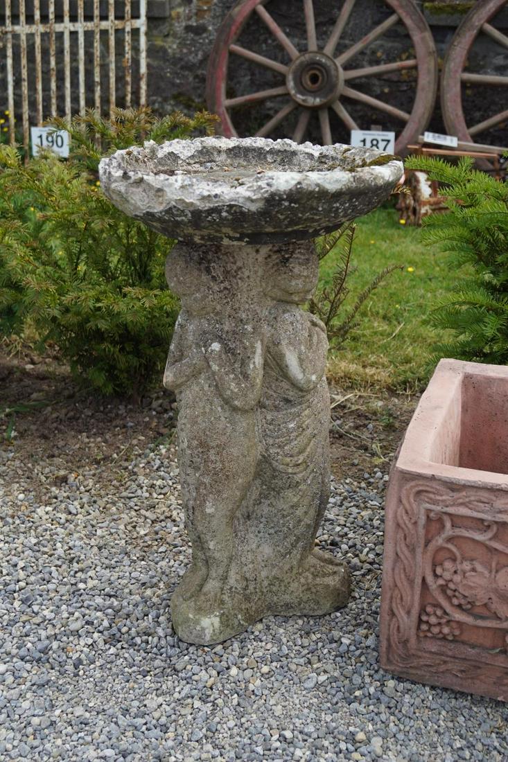 MOULDED STONE BIRD BATH: raised on a figural stem. Approximate Time: 12:35 Lot No: 174 Category: Garden & Decorative Objects