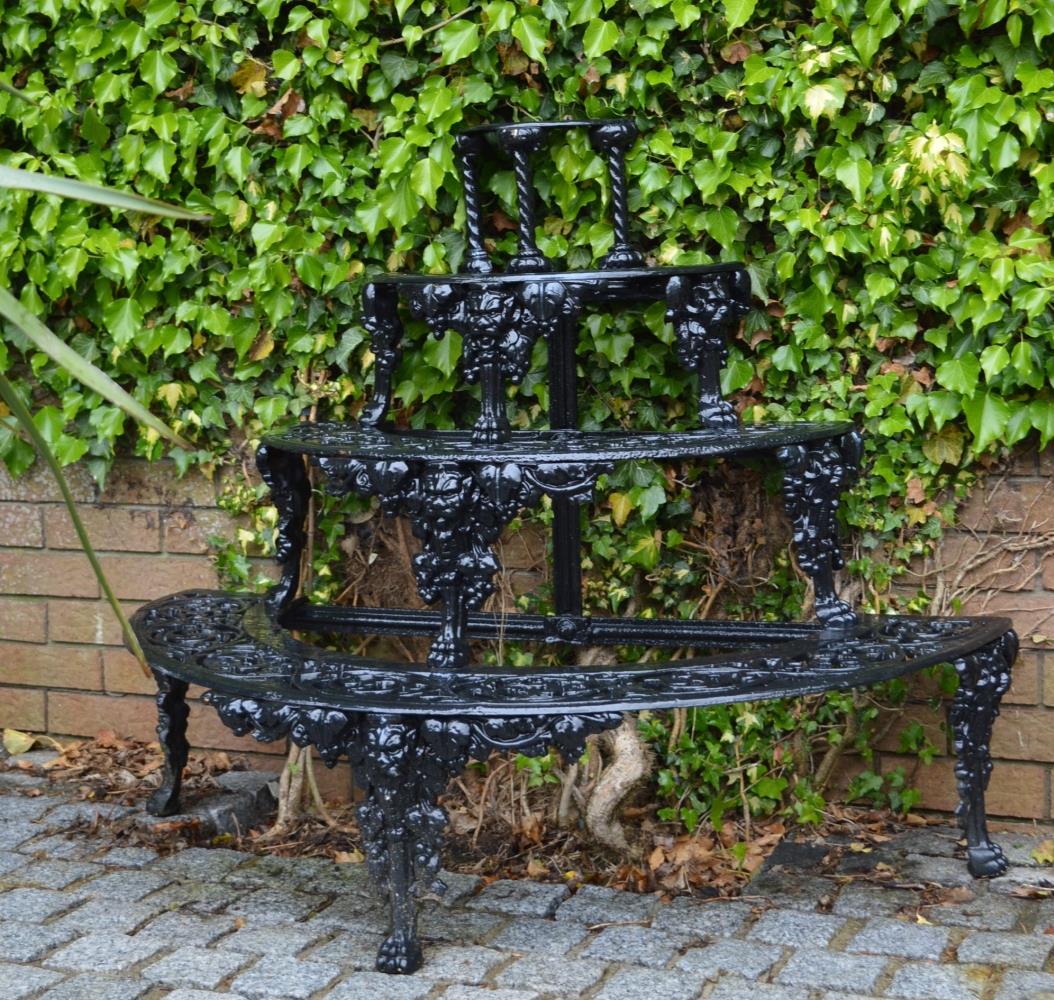 COALBROOKDALE CAST IRON 4 TIER PLANT STAND: of demi-lune shape. Approximate Time: 12:44 Lot No: 184 Category: Garden & Decorative Objects