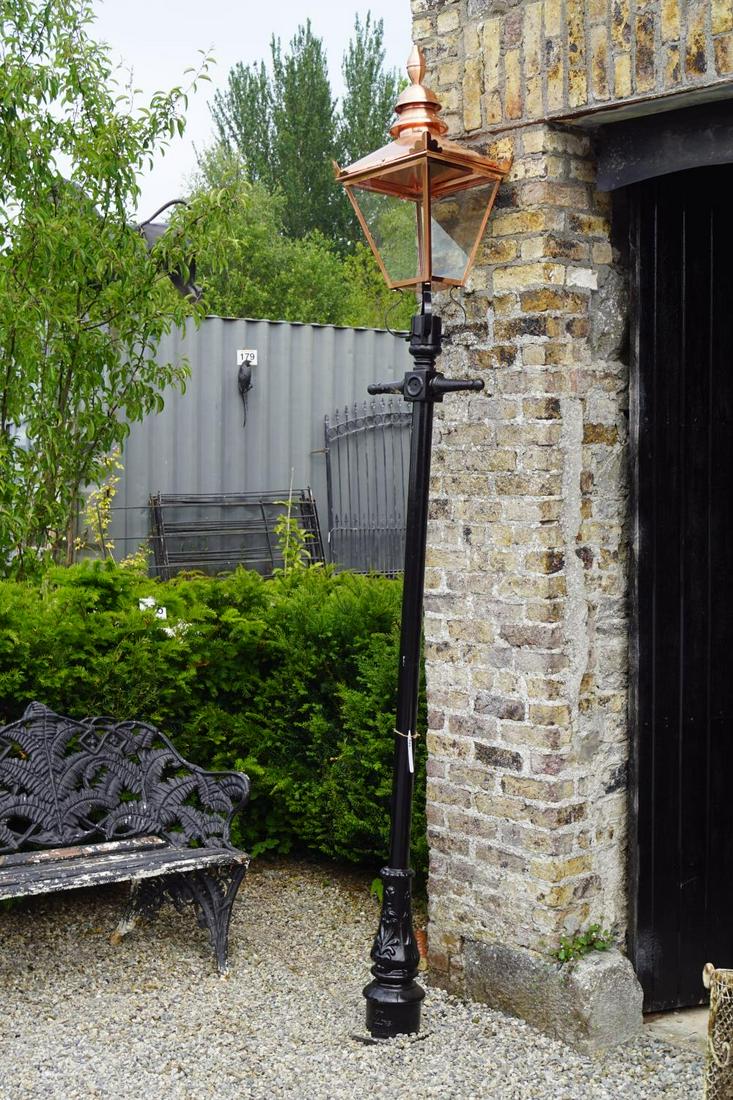 COPPER STREET LANTERN: raised on a cast iron standard. Approximate Time: 12:46 Lot No: 186 Category: Garden & Decorative Objects