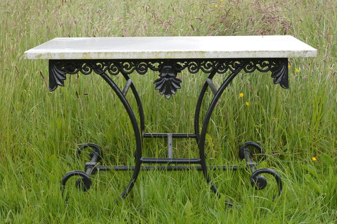 FRENCH METAL BUTCHER'S TABLE: with rectangular marble top, raised on scroll supports. 77 cm. high; 120 cm. wide; 80 cm. deep; Approximate Time: 12:59 Lot No: 200 Category: Garden & Decorative Objects