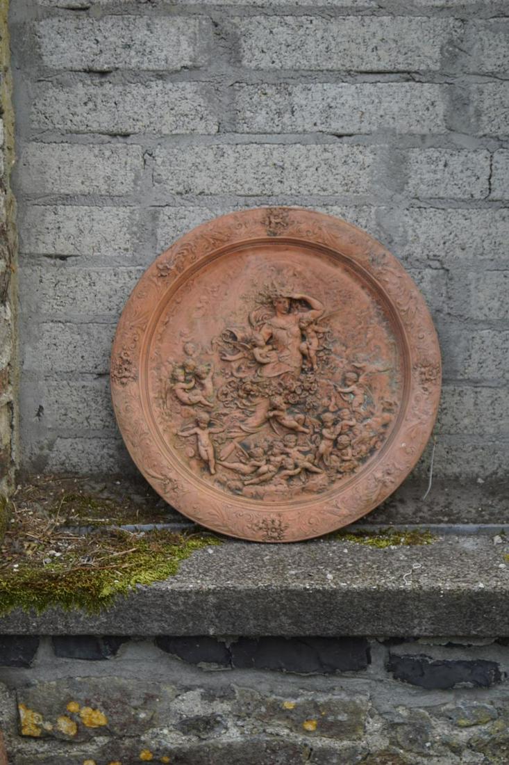 CIRCULAR TERRACOTTA PLAQUE: depicting a classical scene. 62 cm. diameter Approximate Time: 14:06 Lot No: 208 Category: Garden & Decorative Objects