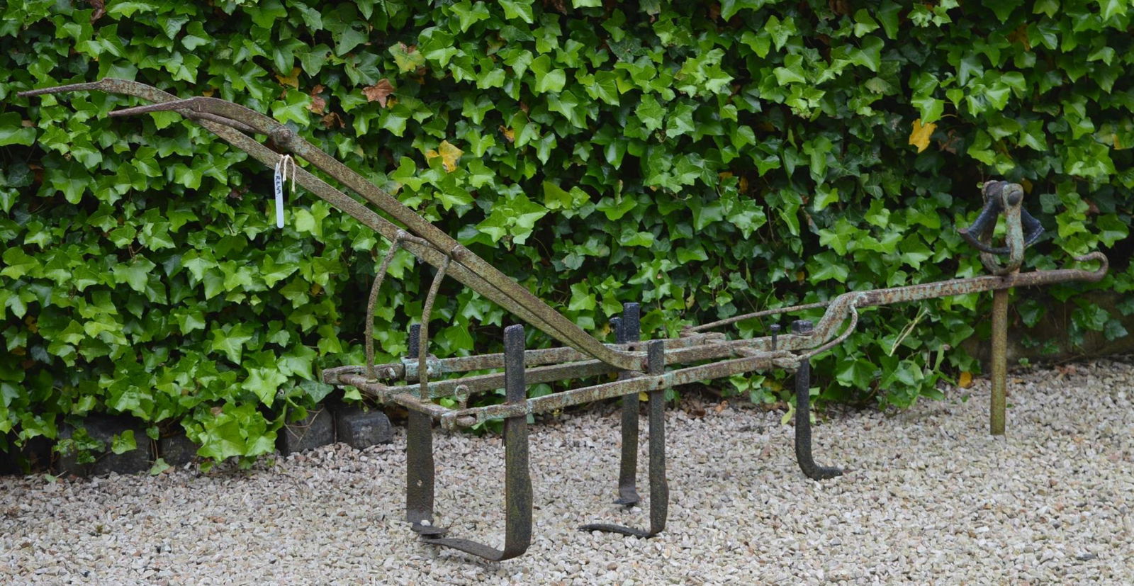 19TH-CENTURY FORGED IRON HORSE GRUBBER: 19th-century forged iron horse grubber. 123 cm. long Approximate Time: 14:13 Lot No: 216 Category: Garden & Decorative Objects