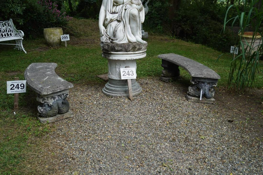 PAIR OF RECONSTITUTED STONE GARDEN BENCHES: each with an egg and dart moulded elliptical shaped seat, raised on fish scroll ends. 45 cm. high; 127 cm. wide; Approximate Time: 14:43 Lot No: 249 Category: Garden & Decorative Objects
