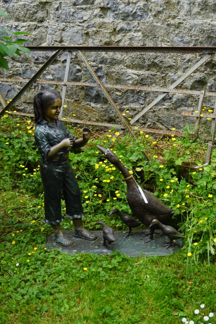 LARGE BRONZE GARDEN SCULPTURE GROUP: Figure of a young girl with a goose and goslings. Approximate Time: 14:55 Lot No: 263 Category: Garden & Decorative Objects