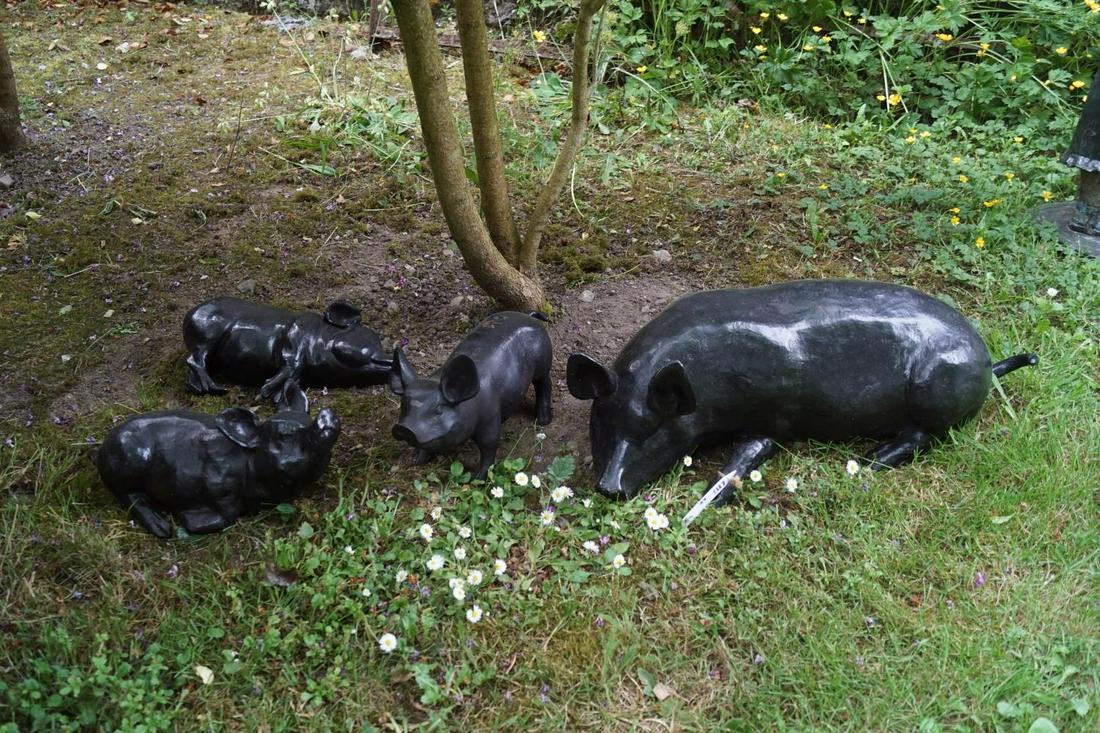 CAST IRON GROUP OF PIGS: Sow and 3 piglets. 25 cm. high; 70 cm. wide Approximate Time: 14:56 Lot No: 264 Category: Garden & Decorative Objects
