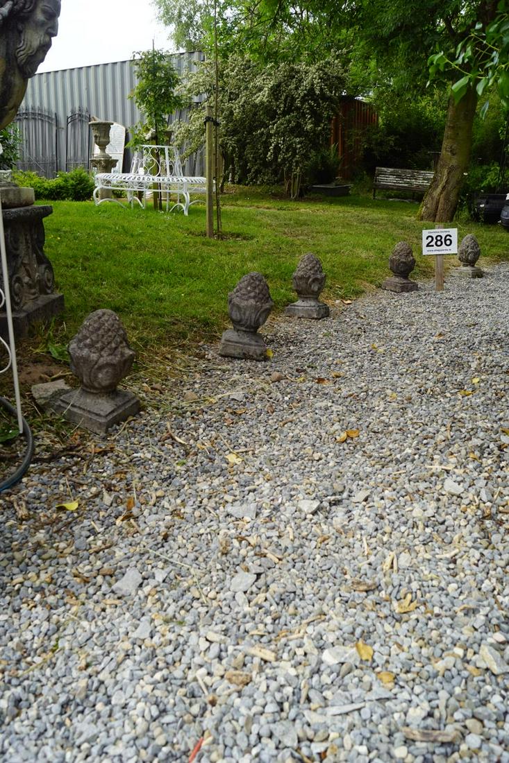 GROUP OF FOUR WEATHERED COMPOSITE STONE ACORNS: each with a square base. 30 cm. high; Approximate Time: 15:16 Lot No: 286 Category: Garden & Decorative Objects