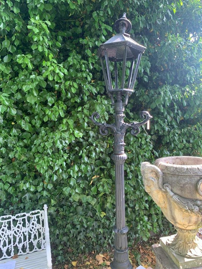 PAIR OF CAST IRON GARDEN LIGHTS: each raised on a tall standard. Approximate Time: 15:19 Lot No: 289 Category: Garden & Decorative Objects