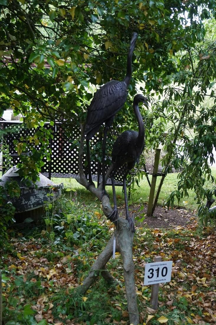 ENGAGING LARGE BRONZE GARDEN SCULPTURE GROUP: Two cranes mounted on a tree trunk. Approximate Time: 15:38 Lot No: 310 Category: Garden & Decorative Objects