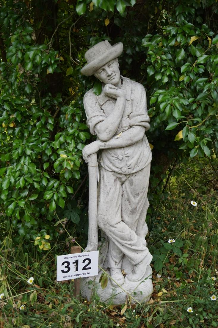 MOULDED STONE GARDEN SCULPTURE: Figure of a man resting on a spade. 145 cm. high; 43 cm. wide Approximate Time: 15:39 Lot No: 312 Category: Garden & Decorative Objects