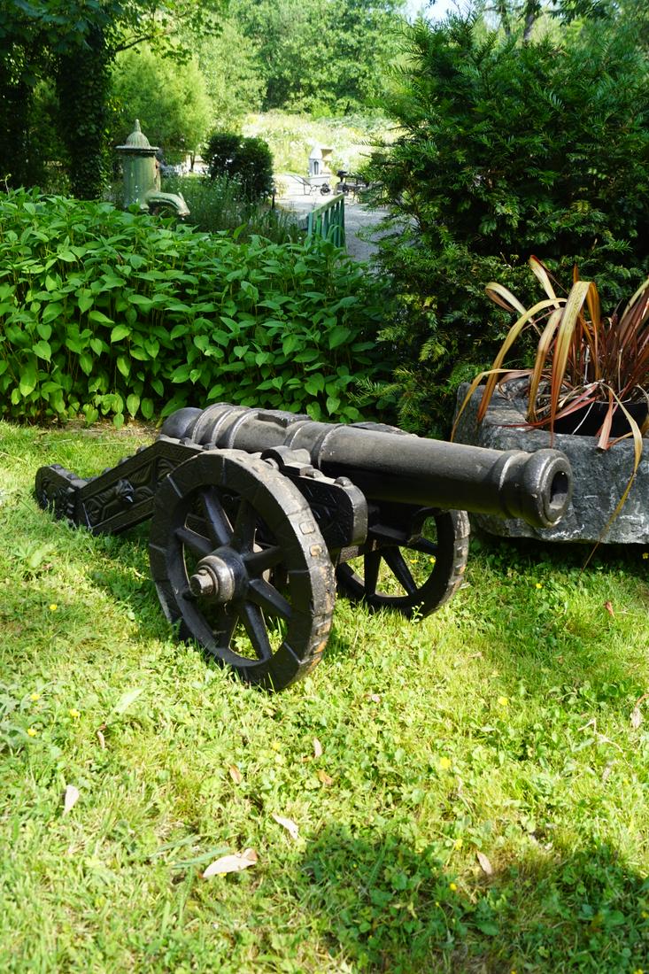 CAST IRON CANNON: mounted on a twin wheel carriage. 58 cm. high; 140 cm. wide; 55 cm. deep Approximate Time: 10:03 Lot No: 405 Category: Garden & Decorative Objects