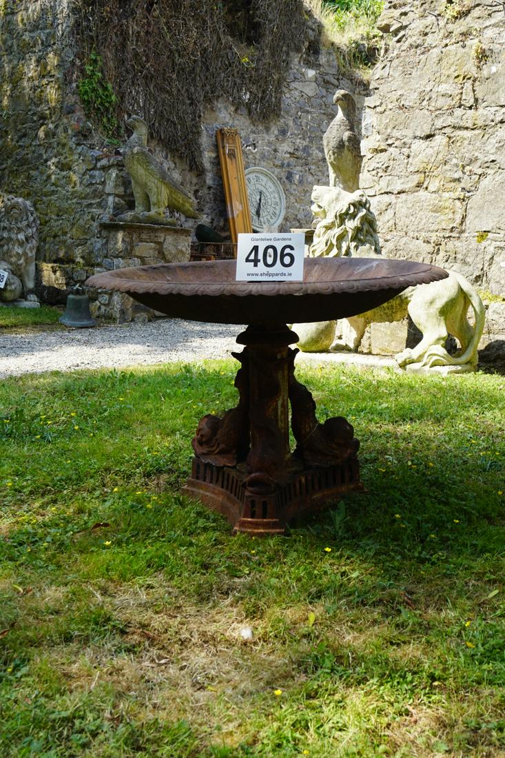 LARGE 19TH-CENTURY CAST IRON GARDEN CENTREPIECE: raised on dolphin supports. 77 cm. high; 110 cm. wide Approximate Time: 10:04 Lot No: 406 Category: Garden & Decorative Objects