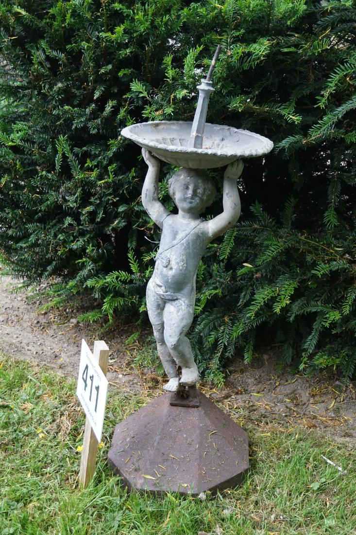 19TH-CENTURY LEAD FOUNTAIN: with standing putto stem, supporting a circular bowl, mounted on a cast iron base. 100 cm. high; Approximate Time: 10:09 Lot No: 411 Category: Garden & Decorative Objects